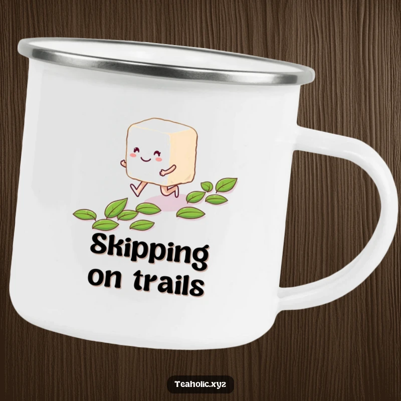 Funny smiling sugar cube character skipping along a path of tea leaves on a durable camping mug.