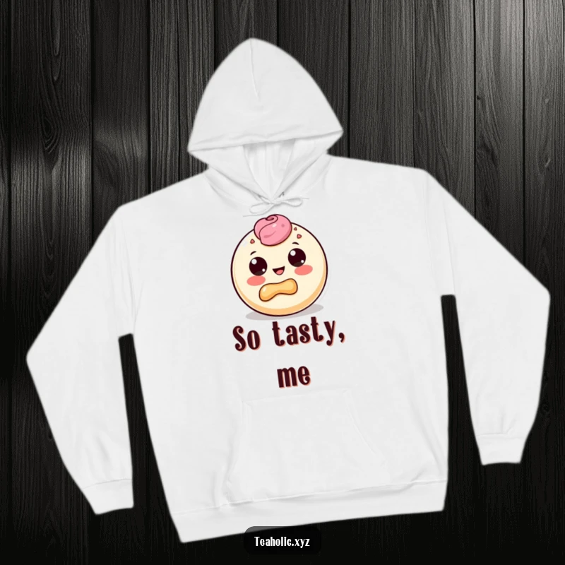 Funny hoodie depicting a round pastry character with prominent dot eyes, gleefully taking a satisfied bite out of its own pastry body.