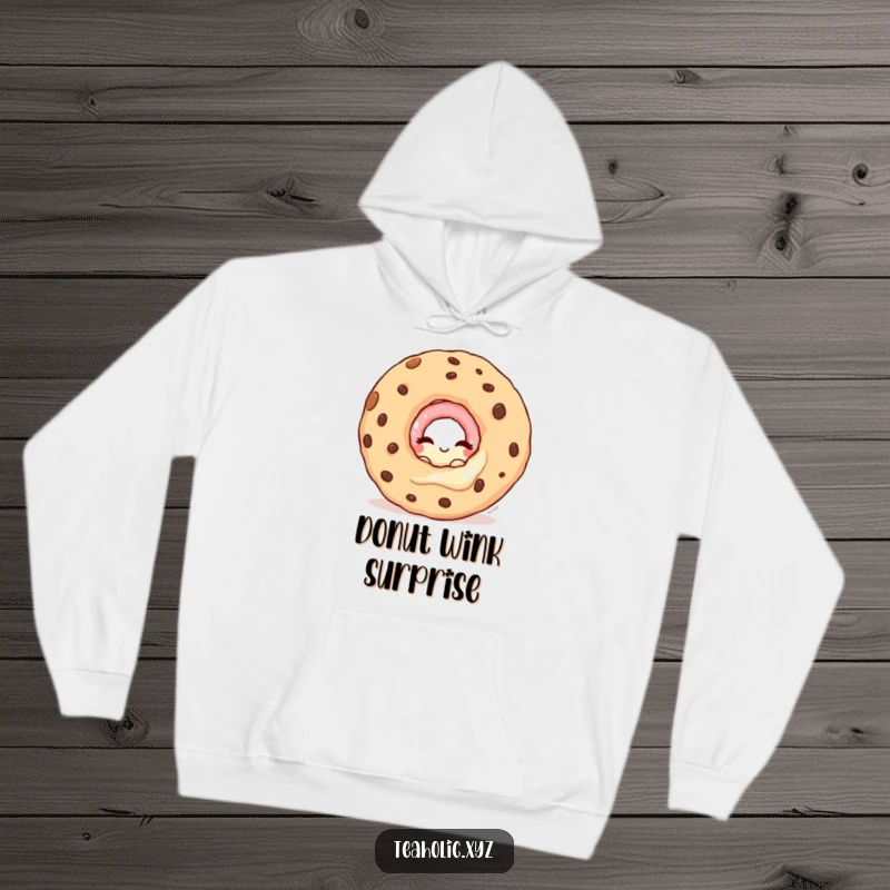 Funny hoodie featuring a winking donut character peeking from behind a giant cookie, perfect for cozy hideaways.
