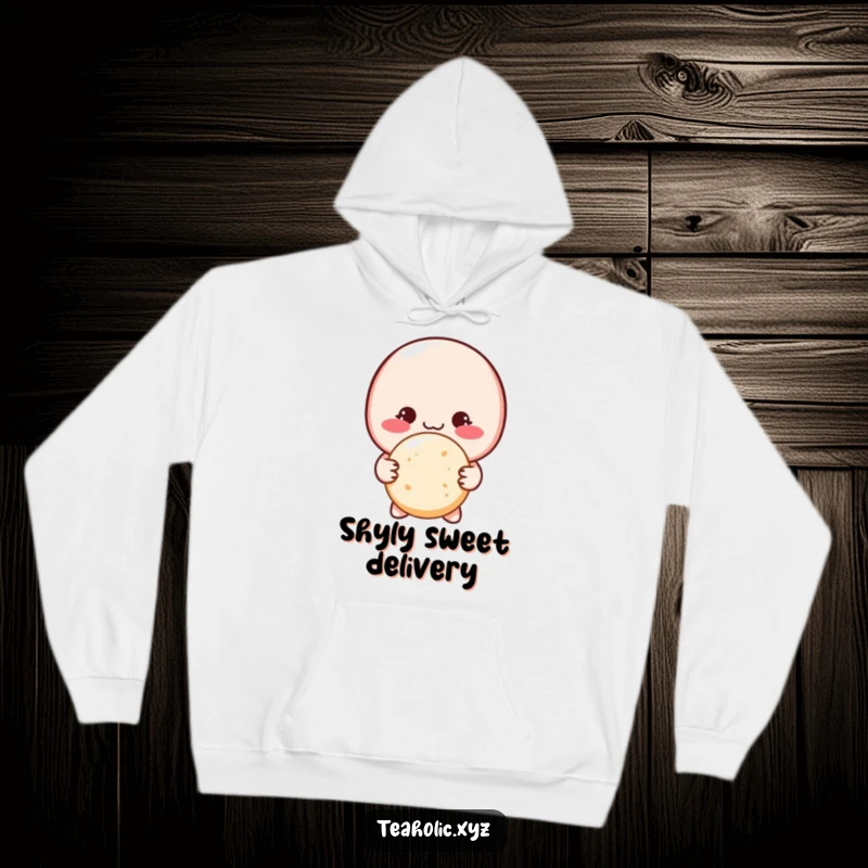 Funny shy macaron character with a blush, offering a sugar cookie with both hands, featured on a soft hoodie.
