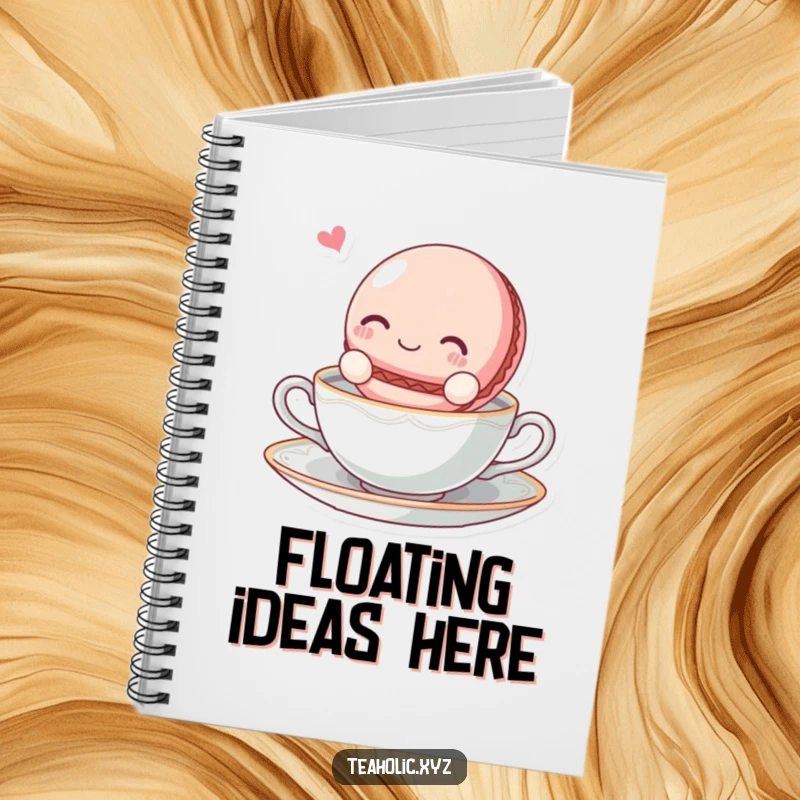 Funny blissful macaroon character floating on a tea saucer on the cover of a lined notebook.